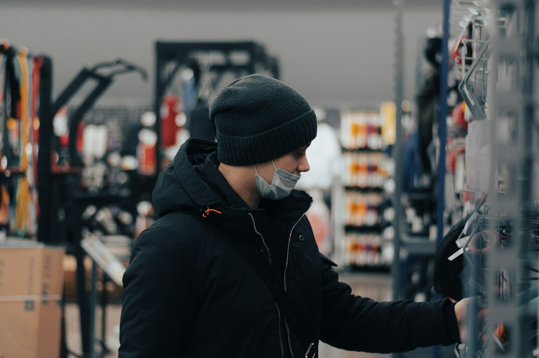 man browsing electronics store